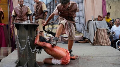 Venezuela: On Friday, April 18, 2025, during Holy Week celebrations in the Petare neighbourhood of Caracas, Venezuela, a devotee dressed as a Roman soldier placed his foot on the back of a penitent, reenacting the role of Jesus Christ in the solemn Way of the Cross procession. The powerful portrayal was part of the community’s tradition of honouring the passion of Christ. (AP Photo/Ariana Cubillos) Venezuela: On Friday, April 18, 2025, during Holy Week celebrations in the Petare neighbourhood of Caracas, Venezuela, a devotee dressed as a Roman soldier placed his foot on the back of a penitent, reenacting the role of Jesus Christ in the solemn Way of the Cross procession. The powerful portrayal was part of the community’s tradition of honouring the passion of Christ. (AP Photo/Ariana Cubillos)