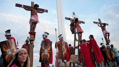 Venezuela: On Good Friday, April 18, 2025, penitents were depicted hanging on crosses in a powerful reenactment of the Way of the Cross during Holy Week celebrations in the Petare neighbourhood of Caracas, Venezuela. The solemn scene served as a vivid representation of Christ’s suffering. (AP Photo/Ariana Cubillos) Venezuela: On Good Friday, April 18, 2025, penitents were depicted hanging on crosses in a powerful reenactment of the Way of the Cross during Holy Week celebrations in the Petare neighbourhood of Caracas, Venezuela. The solemn scene served as a vivid representation of Christ’s suffering. (AP Photo/Ariana Cubillos)