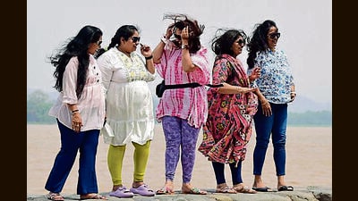 Visitors enjoying the weather at Sukhna lake in Chandigarh on Saturday. (Ravi Kumar/HT)