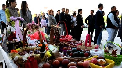Orthodox Christians walk behind baskets with eggs on the sidelines of the Easter service at the Cathedral in Podgorica, Montenegro, on April 20, 2025. (Photo by SAVO PRELEVIC / AFP) (AFP) Orthodox Christians walk behind baskets with eggs on the sidelines of the Easter service at the Cathedral in Podgorica, Montenegro, on April 20, 2025. (Photo by SAVO PRELEVIC / AFP) (AFP)