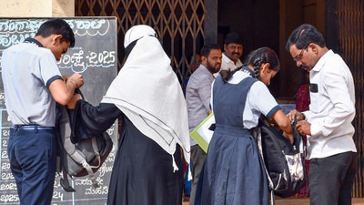 Hubballi: Staffers check students who arrive for the annual SSLC exam, in Hubballi, Karnataka, Friday, March 21, 2025. (Representative image) (PTI) Hubballi: Staffers check students who arrive for the annual SSLC exam, in Hubballi, Karnataka, Friday, March 21, 2025. (Representative image) (PTI)