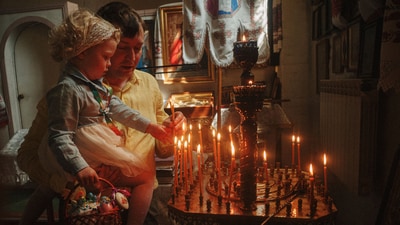 A father helps his daughter to light a candle during the celebration of Orthodox Easter at St. John Theologian Church of the Orthodox Church of Ukraine in Kharkiv, Ukraine, on Sunday, April 20, 2025. (AP Photo/George Ivanchenko) (AP) A father helps his daughter to light a candle during the celebration of Orthodox Easter at St. John Theologian Church of the Orthodox Church of Ukraine in Kharkiv, Ukraine, on Sunday, April 20, 2025. (AP Photo/George Ivanchenko) (AP)