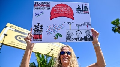 Demonstrators rally against Trump and join forces during a protest organized by the 50501 Movement on April 19, 2025, in Cocoa, Florida. Organisers of the nationwide protest claimed the demonstrations were to denounce the Trump administration "hostile takeover of government." (Getty Images via AFP) Demonstrators rally against Trump and join forces during a protest organized by the 50501 Movement on April 19, 2025, in Cocoa, Florida. Organisers of the nationwide protest claimed the demonstrations were to denounce the Trump administration "hostile takeover of government." (Getty Images via AFP)