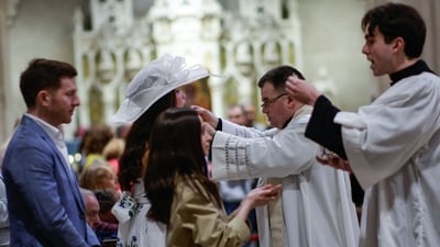 People receive the Comunion as they attend morning mass at Saint Patrick's Cathedral before the Easter Bonnet Parade on April 20, 2025 in New York City. (Photo by KENA BETANCUR / GETTY IMAGES NORTH AMERICA / Getty Images via AFP) (Getty Images via AFP) People receive the Comunion as they attend morning mass at Saint Patrick's Cathedral before the Easter Bonnet Parade on April 20, 2025 in New York City. (Photo by KENA BETANCUR / GETTY IMAGES NORTH AMERICA / Getty Images via AFP) (Getty Images via AFP)
