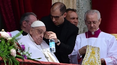 Pope Francis prepares to speak from the main balcony of St. Peter's basilica for the Urbi et Orbi message and blessing to the city and the world as part of Easter celebrations, at St Peter's square in the Vatican on April 20, 2025. (Photo by Tiziana FABI / AFP) (AFP) Pope Francis prepares to speak from the main balcony of St. Peter's basilica for the Urbi et Orbi message and blessing to the city and the world as part of Easter celebrations, at St Peter's square in the Vatican on April 20, 2025. (Photo by Tiziana FABI / AFP) (AFP)