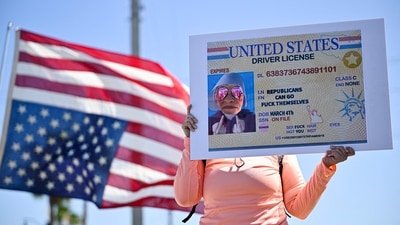 Demonstrators rally against Trump and join forces during a protest organized by the 50501 Movement on April 19, 2025, in Cocoa, Florida. (Getty Images via AFP) Demonstrators rally against Trump and join forces during a protest organized by the 50501 Movement on April 19, 2025, in Cocoa, Florida. (Getty Images via AFP)