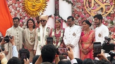 Harshita Kejriwal and Sambhav Jain pose for a photograph at their wedding.