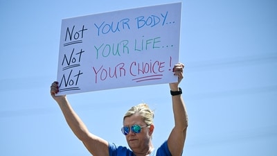 Demonstrators rally against Trump and join forces during a protest organised by the 50501 Movement on April 19, 2025, in Cocoa, Florida. (Getty Images via AFP) Demonstrators rally against Trump and join forces during a protest organised by the 50501 Movement on April 19, 2025, in Cocoa, Florida. (Getty Images via AFP)