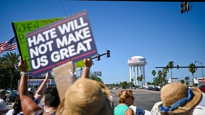 Demonstrators rally against Trump and join forces during a protest organized by the 50501 Movement on April 19, 2025, in Cocoa, Florida. Organisers of the nationwide protest claimed the demonstrations were to denounce the Trump administration "hostile takeover of government." (Getty Images via AFP) Demonstrators rally against Trump and join forces during a protest organized by the 50501 Movement on April 19, 2025, in Cocoa, Florida. Organisers of the nationwide protest claimed the demonstrations were to denounce the Trump administration "hostile takeover of government." (Getty Images via AFP)