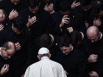 Pope Francis prays with priests at the end of a limited public audience at the San Damaso courtyard in The Vatican on September 30, 2020 during the COVID-19 infection, caused by the novel coronavirus.&nbsp;