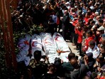 Palestinians mourn medics, who came under Israeli fire while on a rescue mission, after their bodies were recovered, according to the Red Crescent, at Nasser hospital in Khan Younis in the southern Gaza Strip.