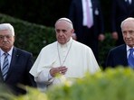 Pope Francis flanked by Israel's then President Shimon Peres, right, and Palestinian President Mahmoud Abbas during an evening of peace prayers in the Vatican, Sunday, June 8, 2014. (AP Photo/Gregorio Borgia, file) Pope Francis flanked by Israel's then President Shimon Peres, right, and Palestinian President Mahmoud Abbas during an evening of peace prayers in the Vatican, Sunday, June 8, 2014. (AP Photo/Gregorio Borgia, file)