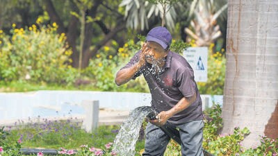 A man cools himself in Gurugram Sector 29 on Monday. (Parveen Kumar/HT Photo) A man cools himself in Gurugram Sector 29 on Monday. (Parveen Kumar/HT Photo)