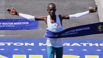John Korir, of Kenya, breaks the tape to win the Boston Marathon, Monday, April 21, 2025, in Boston. AP/PTI(AP04_21_2025_000489A) (AP) John Korir, of Kenya, breaks the tape to win the Boston Marathon, Monday, April 21, 2025, in Boston. AP/PTI(AP04_21_2025_000489A) (AP)