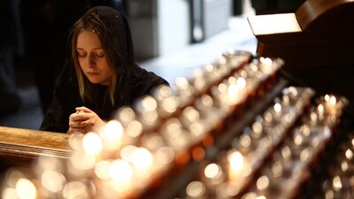 A person pays their respects inside The Metropolitan Cathedral of the Most Precious Blood, informally known as Westminster Cathedral, in central London on April 21, 2025, following the news of the death of Pope Francis. Pope Francis died on April 21, 2025 aged 88, a day after making a much hoped-for appearance at Saint Peter's Square on Easter Sunday, the Vatican said in a statement. (Photo by HENRY NICHOLLS / AFP) (AFP) A person pays their respects inside The Metropolitan Cathedral of the Most Precious Blood, informally known as Westminster Cathedral, in central London on April 21, 2025, following the news of the death of Pope Francis. Pope Francis died on April 21, 2025 aged 88, a day after making a much hoped-for appearance at Saint Peter's Square on Easter Sunday, the Vatican said in a statement. (Photo by HENRY NICHOLLS / AFP) (AFP)