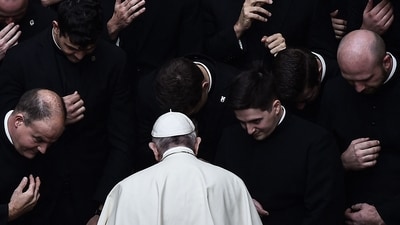Pope Francis prays with priests at the end of a limited public audience at the San Damaso courtyard in The Vatican on September 30, 2020 during the COVID-19 infection, caused by the novel coronavirus. (AFP) Pope Francis prays with priests at the end of a limited public audience at the San Damaso courtyard in The Vatican on September 30, 2020 during the COVID-19 infection, caused by the novel coronavirus. (AFP)