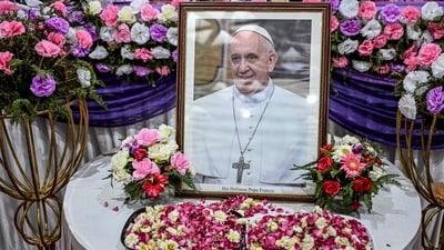 A portrait of Pope Francis is pictured during a condolence meeting in New Delhi on April 21, 2025, following the news of his death. (Photo by Sajjad HUSSAIN / AFP) (AFP) A portrait of Pope Francis is pictured during a condolence meeting in New Delhi on April 21, 2025, following the news of his death. (Photo by Sajjad HUSSAIN / AFP) (AFP)