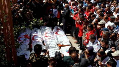 Palestinians mourn medics, who came under Israeli fire while on a rescue mission, after their bodies were recovered, according to the Red Crescent, at Nasser hospital in Khan Younis in the southern Gaza Strip. (File/REUTERS)