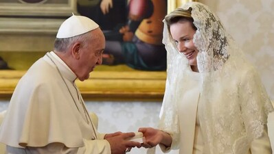 Pope Francis gives a rosary to Queen Mathilde of Belgium during a private audience on March 9, 2015, at the Vatican. GABRIEL BOUYS/POOL/AFP via Getty Images 