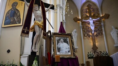 A portrait of the late Pope Francis sits at Moscow's Cathedral of Virgin Mary Immaculate Conception on April 21, 2025. Pope Francis, leader of the Catholic Church since March 2013, died on Monday aged 88. (Photo by Alexander NEMENOV / AFP) (AFP) A portrait of the late Pope Francis sits at Moscow's Cathedral of Virgin Mary Immaculate Conception on April 21, 2025. Pope Francis, leader of the Catholic Church since March 2013, died on Monday aged 88. (Photo by Alexander NEMENOV / AFP) (AFP)