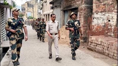 Security personnel keep vigilin Murshidabad on Sunday. (PTI) Security personnel keep vigilin Murshidabad on Sunday. (PTI)