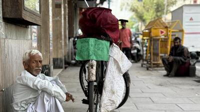 Shiv Shankar beside his bicycle. Shiv Shankar beside his bicycle.