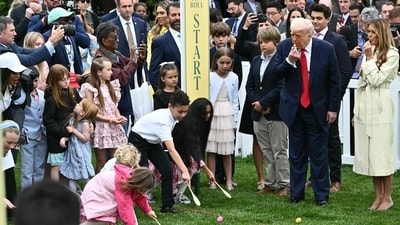 US President Donald Trump and First Lady Melania Trump blow whistles to start a race as children participate in the annual Easter Egg Roll on the South Lawn of the White House on April 21, 2025, in Washington, DC. According to the US National Park Service, the egg roll tradition dates back to 1878 when President Rutherford B. Hayes invited children to roll Easter eggs on the White House grounds. Children previously rolled eggs down a hill at the US Capitol in the early 1870s, but a law was passed in 1876 forbidding the Capitol property from being used due to the toll on the lawn. (Photo by Mandel NGAN / AFP) (AFP) US President Donald Trump and First Lady Melania Trump blow whistles to start a race as children participate in the annual Easter Egg Roll on the South Lawn of the White House on April 21, 2025, in Washington, DC. According to the US National Park Service, the egg roll tradition dates back to 1878 when President Rutherford B. Hayes invited children to roll Easter eggs on the White House grounds. Children previously rolled eggs down a hill at the US Capitol in the early 1870s, but a law was passed in 1876 forbidding the Capitol property from being used due to the toll on the lawn. (Photo by Mandel NGAN / AFP) (AFP)