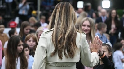 US First Lady Melania Trump high fives a young girl as children participate in the annual Easter Egg Roll on the South Lawn of the White House on April 21, 2025, in Washington, DC. According to the US National Park Service, the egg roll tradition dates back to 1878 when President Rutherford B. Hayes invited children to roll Easter eggs on the White House grounds. Children previously rolled eggs down a hill at the US Capitol in the early 1870s, but a law was passed in 1876 forbidding the Capitol property from being used due to the toll on the lawn. (Photo by Brendan SMIALOWSKI / AFP) (AFP) US First Lady Melania Trump high fives a young girl as children participate in the annual Easter Egg Roll on the South Lawn of the White House on April 21, 2025, in Washington, DC. According to the US National Park Service, the egg roll tradition dates back to 1878 when President Rutherford B. Hayes invited children to roll Easter eggs on the White House grounds. Children previously rolled eggs down a hill at the US Capitol in the early 1870s, but a law was passed in 1876 forbidding the Capitol property from being used due to the toll on the lawn. (Photo by Brendan SMIALOWSKI / AFP) (AFP)
