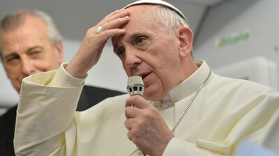 Pope Francis speaks during a news conference aboard the papal flight on its way back from Brazil. Pope Francis reached out to gays, saying he wouldn't judge priests for their sexual orientation in a remarkably open and wide-ranging news conference as he returned from his first foreign trip. (AP) Pope Francis speaks during a news conference aboard the papal flight on its way back from Brazil. Pope Francis reached out to gays, saying he wouldn't judge priests for their sexual orientation in a remarkably open and wide-ranging news conference as he returned from his first foreign trip. (AP)