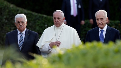 Pope Francis flanked by Israel's then President Shimon Peres, right, and Palestinian President Mahmoud Abbas during an evening of peace prayers in the Vatican, Sunday, June 8, 2014. (AP Photo/Gregorio Borgia, file) (AP) Pope Francis flanked by Israel's then President Shimon Peres, right, and Palestinian President Mahmoud Abbas during an evening of peace prayers in the Vatican, Sunday, June 8, 2014. (AP Photo/Gregorio Borgia, file) (AP)