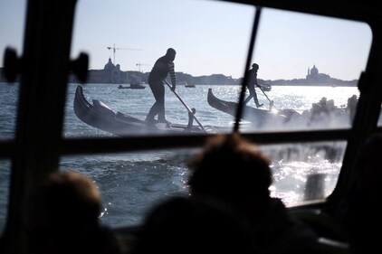 Gondoliers ride their gondolas as the Venice carnival takes place in St. Mark's Square in Venice, Italy, February 15, 2025. REUTERS/Claudia Greco (REUTERS)