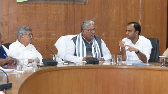 Haryana development and panchayat minister Krishan Lal Panwar during a grievances meeting in Rohtak on Monday. (HT Photo)