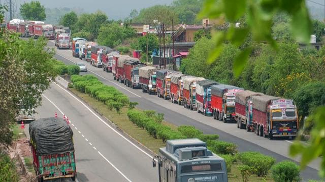 Trucks seen lined up as the National Highway 44 is closed due to landslides in Ramban. (ANI) Trucks seen lined up as the National Highway 44 is closed due to landslides in Ramban. (ANI)
