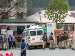 Security personnel stand guard as Injured tourists are being bought to a hospital after terrorists target tourists in J&K's Pahalgam, on Tuesday. 