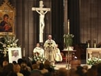 Archbishop Peter Comensoli (C) holds mass as a photo of the late Pope Francis is displayed at St Patrick's Cathedral in Melbourne on April 22, 2025. Pope Francis died of a stroke, the Vatican announced hours after the death on April 21 of the 88-year-old reformer who inspired devotion but riled traditionalists during 12 years leading the Catholic Church. Archbishop Peter Comensoli (C) holds mass as a photo of the late Pope Francis is displayed at St Patrick's Cathedral in Melbourne on April 22, 2025. Pope Francis died of a stroke, the Vatican announced hours after the death on April 21 of the 88-year-old reformer who inspired devotion but riled traditionalists during 12 years leading the Catholic Church.