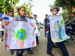 School children hold posters with message to save earth on the eve of 'Word Earth Day', in Prayagraj, Monday, April 21, 2025. School children hold posters with message to save earth on the eve of 'Word Earth Day', in Prayagraj, Monday, April 21, 2025.