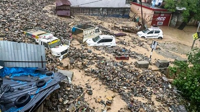 Damaged vehicles lie buried under debris after a cloudburst triggered heavy landslides and flash floods, in Jammu and Kashmir's Ramban on Sunday. (ANI) Damaged vehicles lie buried under debris after a cloudburst triggered heavy landslides and flash floods, in Jammu and Kashmir's Ramban on Sunday. (ANI)