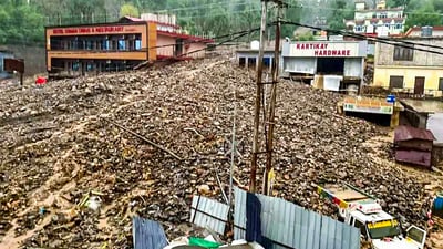 Damages vehicles lie buried under debris after a cloudburst causes landslides and flash floods, in Ramban on Sunday. (ANI) Damages vehicles lie buried under debris after a cloudburst causes landslides and flash floods, in Ramban on Sunday. (ANI)
