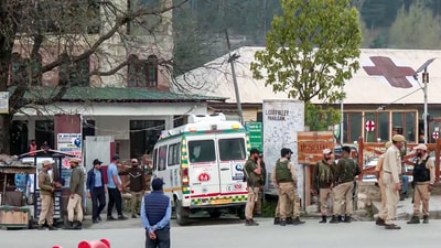Security personnel stand guard as Injured tourists are being bought to a hospital after terrorists target tourists in J&K's Pahalgam, on Tuesday. (ANI Grab) Security personnel stand guard as Injured tourists are being bought to a hospital after terrorists target tourists in J&K's Pahalgam, on Tuesday. (ANI Grab)