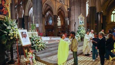 A photo of the late Pope Francis (L) is displayed during mass at St Patrick's Cathedral in Melbourne on April 22, 2025. Pope Francis died of a stroke, the Vatican announced hours after the death on April 21 of the 88-year-old reformer who inspired devotion but riled traditionalists during 12 years leading the Catholic Church. (AFP) A photo of the late Pope Francis (L) is displayed during mass at St Patrick's Cathedral in Melbourne on April 22, 2025. Pope Francis died of a stroke, the Vatican announced hours after the death on April 21 of the 88-year-old reformer who inspired devotion but riled traditionalists during 12 years leading the Catholic Church. (AFP)