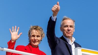 Canada's Prime Minister Mark Carney and his wife Diana Fox Carney wave from his plane in Halifax Stanfield International Airport during his Liberal Party election campaign tour in Goffs, Nova Scotia, Canada, on Monday. (REUTERS) Canada's Prime Minister Mark Carney and his wife Diana Fox Carney wave from his plane in Halifax Stanfield International Airport during his Liberal Party election campaign tour in Goffs, Nova Scotia, Canada, on Monday. (REUTERS)