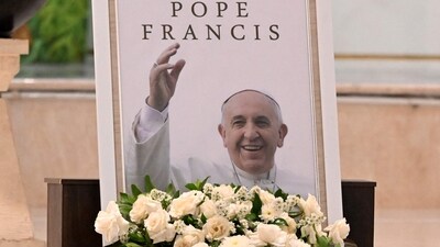 A portrait of Pope Francis is seen displayed at the altar of St. Francis Xavier Catholic Church in Kuta on Indonesia's resort island of Bali on April 22, 2025, a day after his death. (AFP)