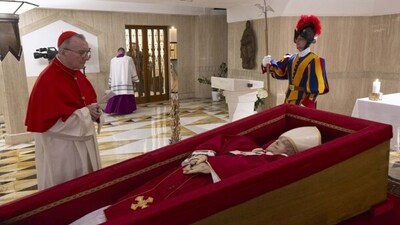 Vatican Secretary of State Cardinal Pietro Parolin, left, prays in front of the body of Pope Francis laid out in state inside his private chapel at the Vatican, Monday, April 21, 2025. (Vatican Media via AP, HO) Vatican Secretary of State Cardinal Pietro Parolin, left, prays in front of the body of Pope Francis laid out in state inside his private chapel at the Vatican, Monday, April 21, 2025. (Vatican Media via AP, HO)