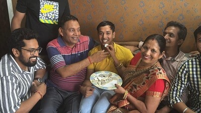 State topper Aditya Vikram Agarwal celebrating with his family in Jhajjar on Tuesday. (HT Photo) State topper Aditya Vikram Agarwal celebrating with his family in Jhajjar on Tuesday. (HT Photo)