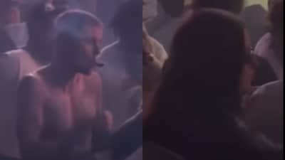 Justin Bieber can be seen smoking a joint while Hailey pushes Jason away from the crowd. (X) Justin Bieber can be seen smoking a joint while Hailey pushes Jason away from the crowd. (X)