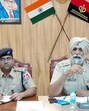 DCP law and order Parminder Singh Bhandal and other officials addressing a press conference on Wednesday. (HT Photo)