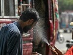 A volunteer of the Edhi Foundation sprays water on a passerby's face to cool off on a hot summer day along a road amid the ongoing heatwave in Karachi on April 21, 2025. (Photo by Asif HASSAN / AFP) A volunteer of the Edhi Foundation sprays water on a passerby's face to cool off on a hot summer day along a road amid the ongoing heatwave in Karachi on April 21, 2025. (Photo by Asif HASSAN / AFP)