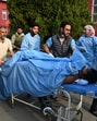 Paramedics carry an injured tourist to a hospital in Anantnag on Tuesday. (Waseem Andrabi /HT) Paramedics carry an injured tourist to a hospital in Anantnag on Tuesday. (Waseem Andrabi /HT)