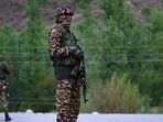 Paramilitary soldiers stands guard near Pahalgam, south of Srinagar, on Tuesday (HT Photo)