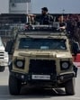 Security forces escort an ambulance following a terror attack near Pahalgam. (REUTERS) Security forces escort an ambulance following a terror attack near Pahalgam. (REUTERS)